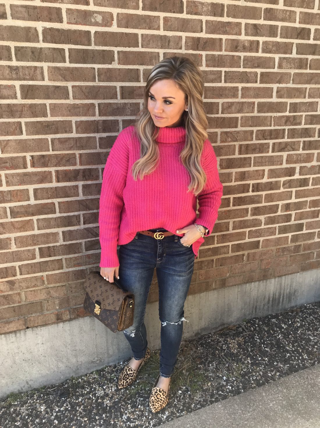 Casual outfit for transitioning to spring. Hot Pink Sweater with high waisted jeans and leopard flats.