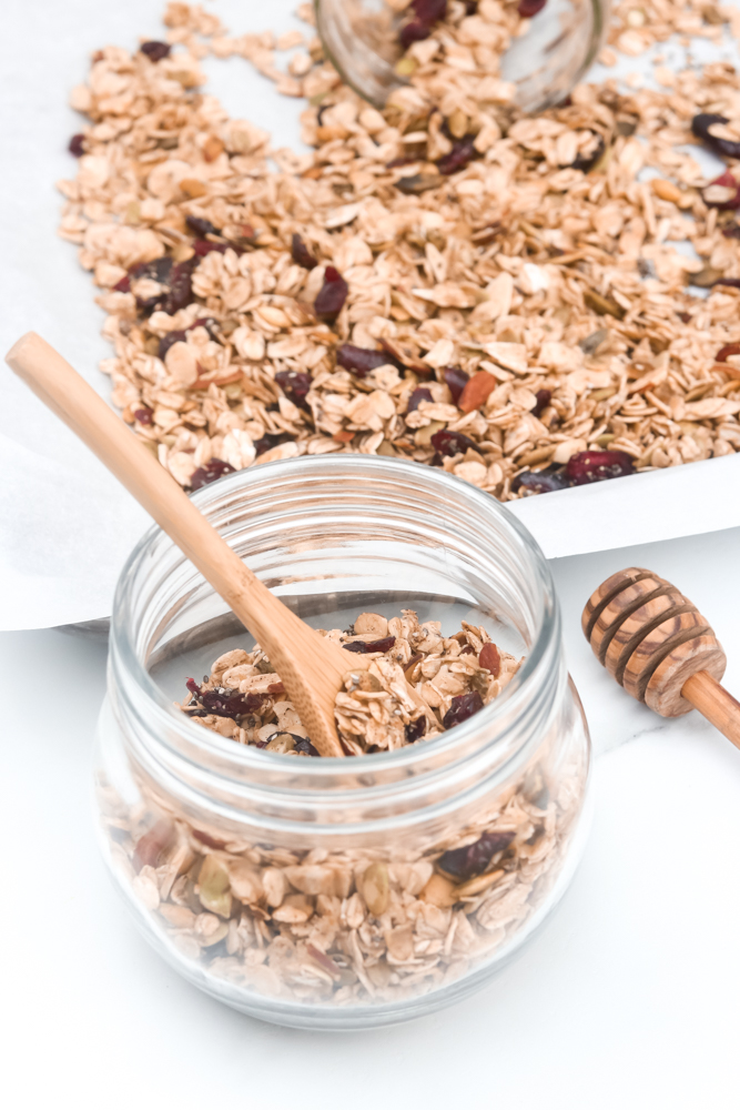 Easy Homemade Healthy Granola. Full of oats, nuts, cranberries, vanilla, cinnamon, and maple syrup.