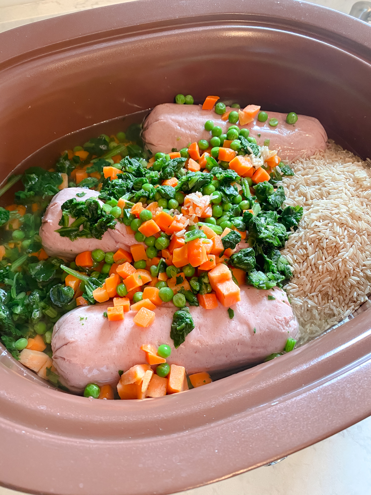 Homemade dog food in crockpot with frozen vegetables, ground turkey and rice.