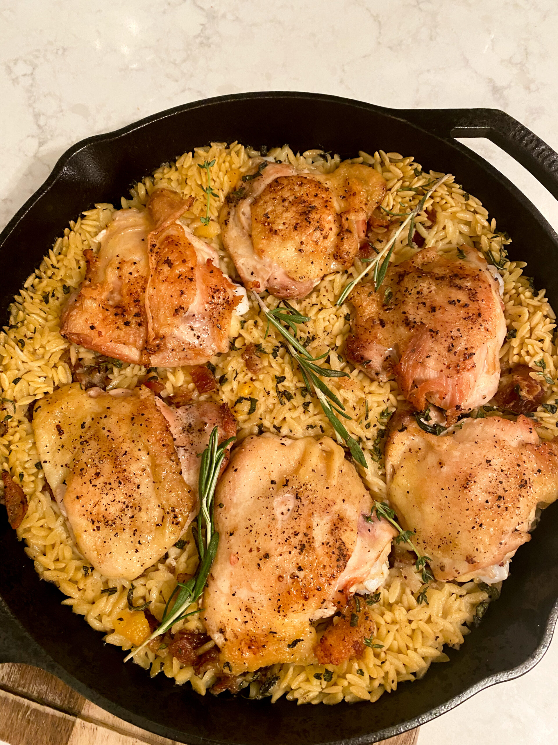 One skillet Chicken Thighs with Orzo and dates.